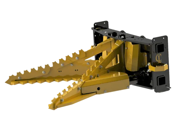 The attachment has a black, V-shaped body with a yellow triangular section at the front. There are two long, curved metal teeth extending downwards from the yellow section. The teeth are likely used to grip and pull trees. The attachment also has a number of smaller metal bars and brackets, which help to secure it to the skid steer.