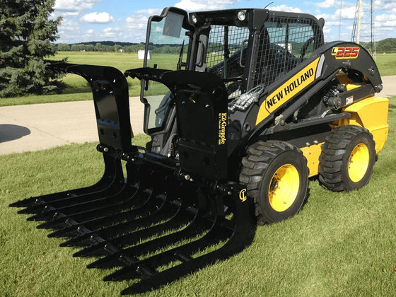 The EZ Grapple attachment is attached to the front of the skid steer loader and  it has several tines or teeth. 