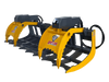 A yellow and black grapple rake attachment for a skid steer loader or bulldozer, on a gray background. The grapple rake is designed to pick up and move debris such as branches, logs, and rocks.
