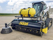  A Digga Sweeper Bucket Broom Attachment in action, sweeping up debris on a paved surface.