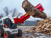 A skid steer loader with a Pro Series Wood Splitter attachment lifting a large log.